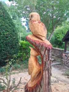 owl and woodpecker tree stump carving